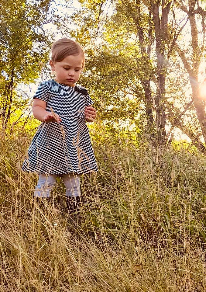 Jaslynn joined the competition — help win amazing prizes! child, clothing, fun, girl, grass, grass_family, meadow, outerwear, pattern, person, plant, play, prairie, spring, toddler, tree
