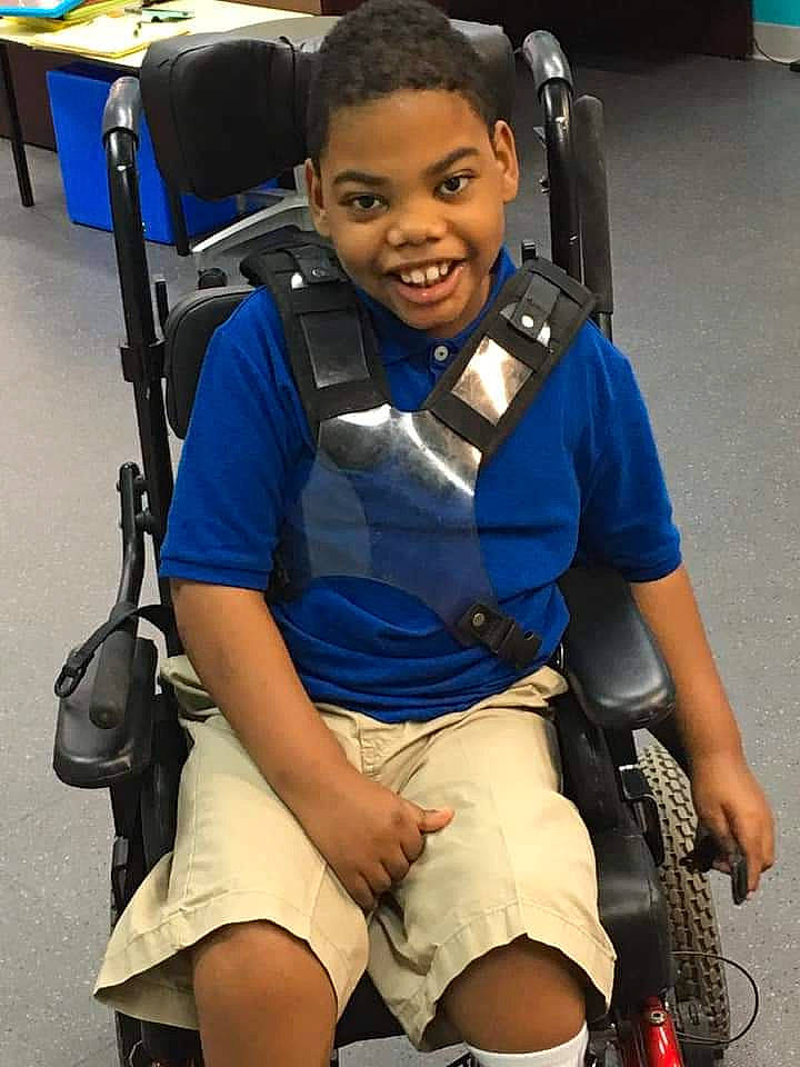 Zephaniah joined the competition — help win amazing prizes! arm, baby_carriage, baby_products, human_body, joy, leg, person, product, thigh, wheelchair