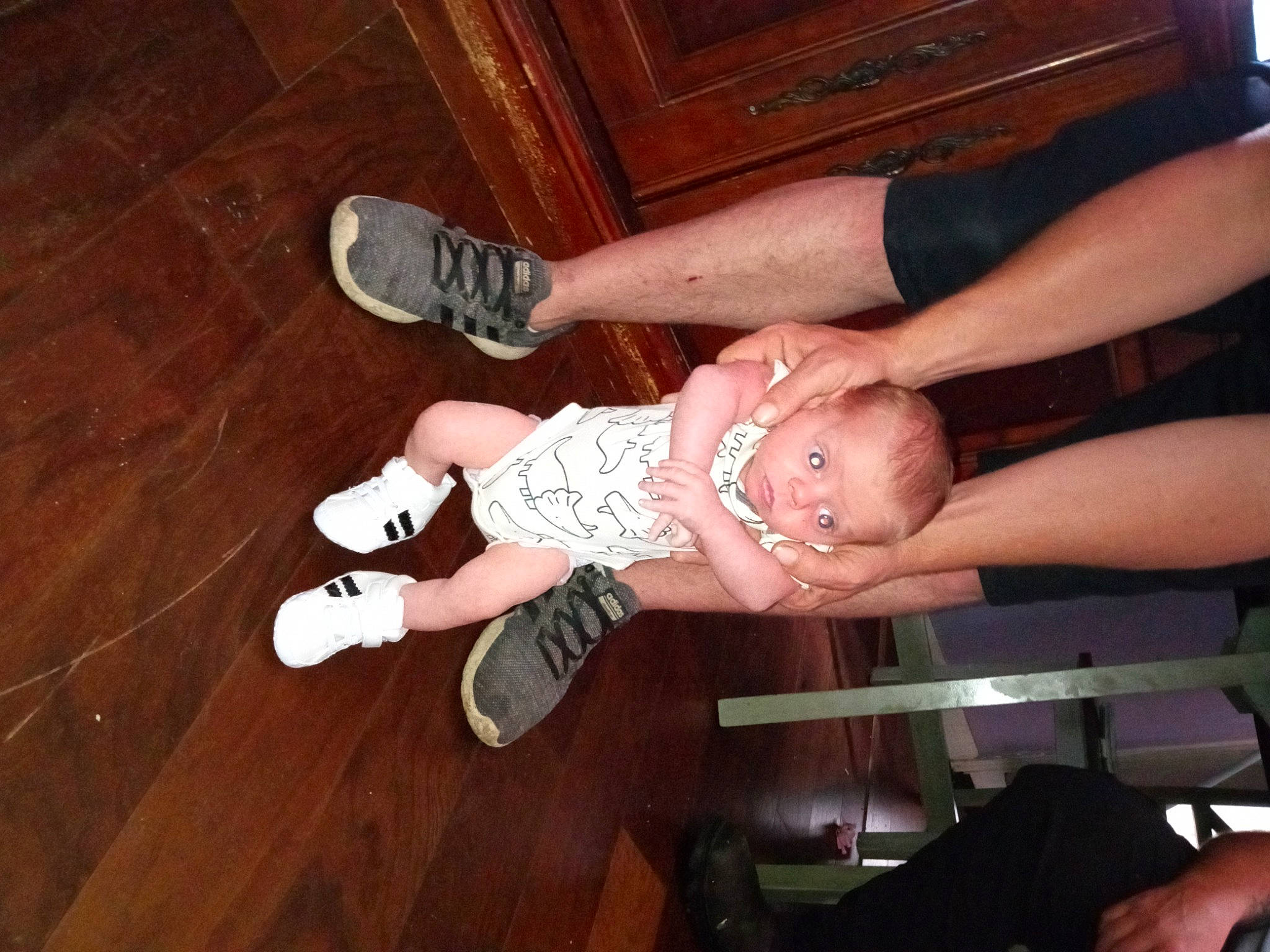 Zaydyn joined the competition — help win amazing prizes! baby, baby_toddler_clothing, flooring, foot, fun, hardwood, human_leg, knee, leg, nail, outdoor_shoe, person, shoe, sneakers, sock, thigh, thumb, toddler, walking_shoe, wood