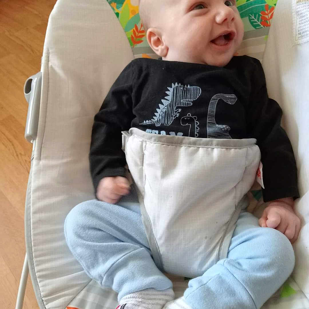 Hayden is registered to the contest to win money with this photo: baby, babylaughing, bed, clothing, cushion, face, furniture, happy, head, homedecor, hosiery, infantbed, jeans, pants, person, photography, portrait, sitting, sock, yawning