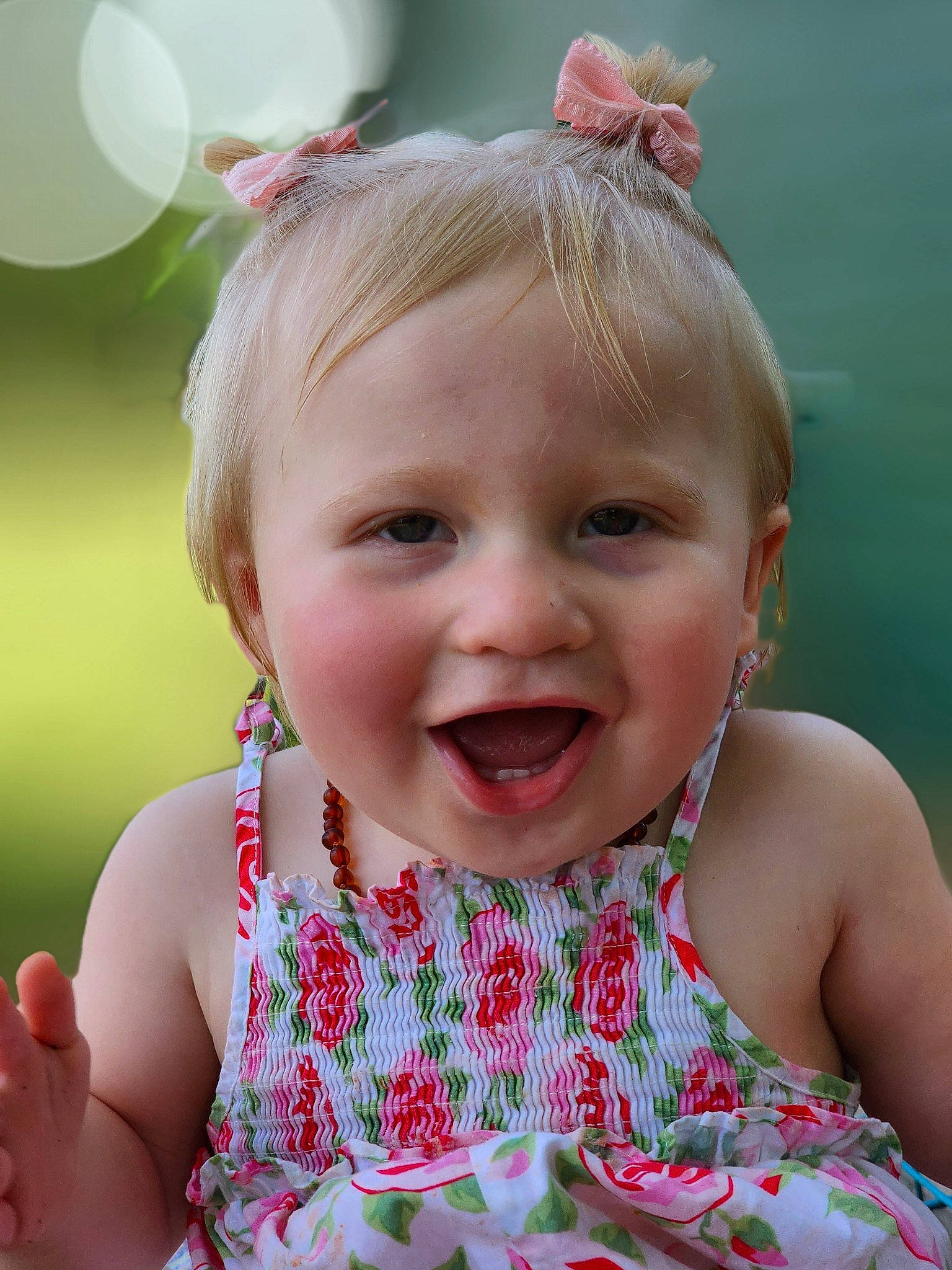 Emmalyn is registered to the contest to win money with this photo: baby, baby_toddler_clothing, cheek, child, dress, eye, face, facial_expression, grass, happy, head, iris, joy, lip, people_in_nature, person, photograph, pink, skin, smile