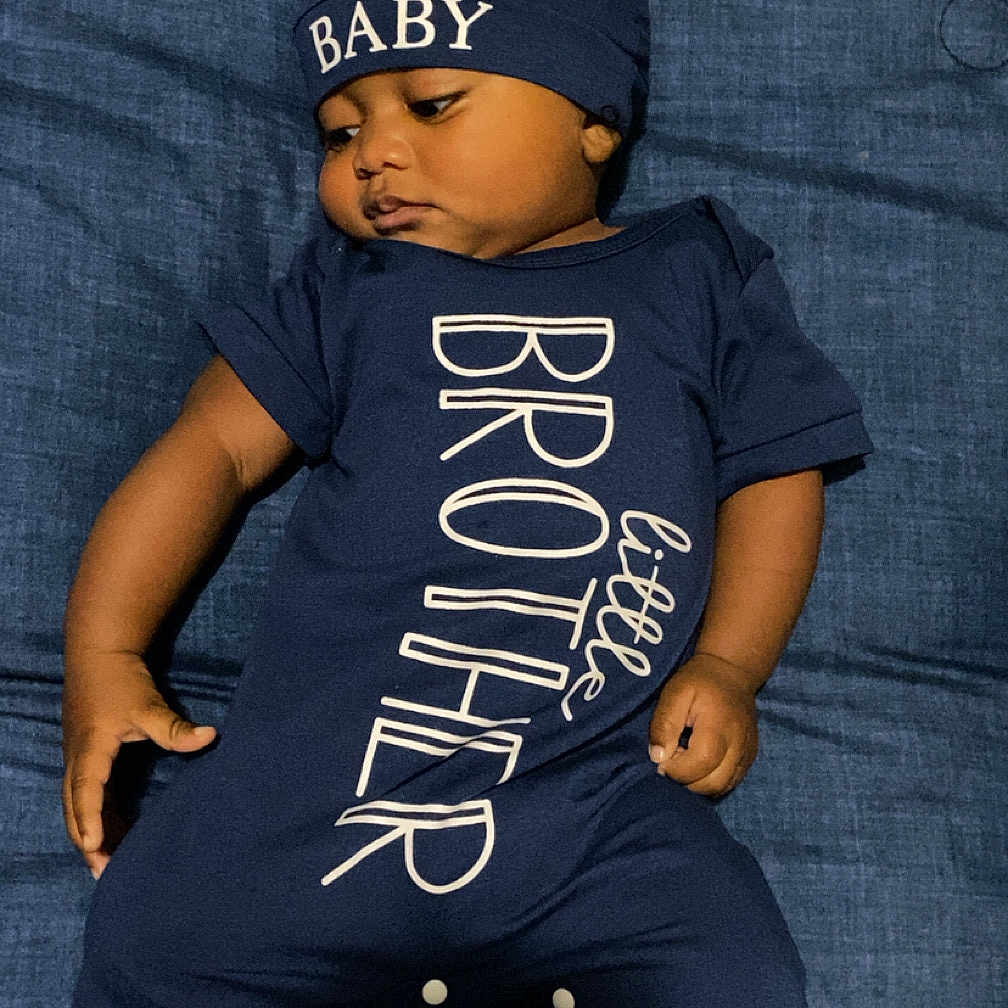 Kashton joined the competition — help win amazing prizes! baby, baseballcap, beanie, bonnet, cap, clothing, couch, face, furniture, hat, head, hood, jeans, newborn, pants, person, photography, portrait, shorts, t_shirt