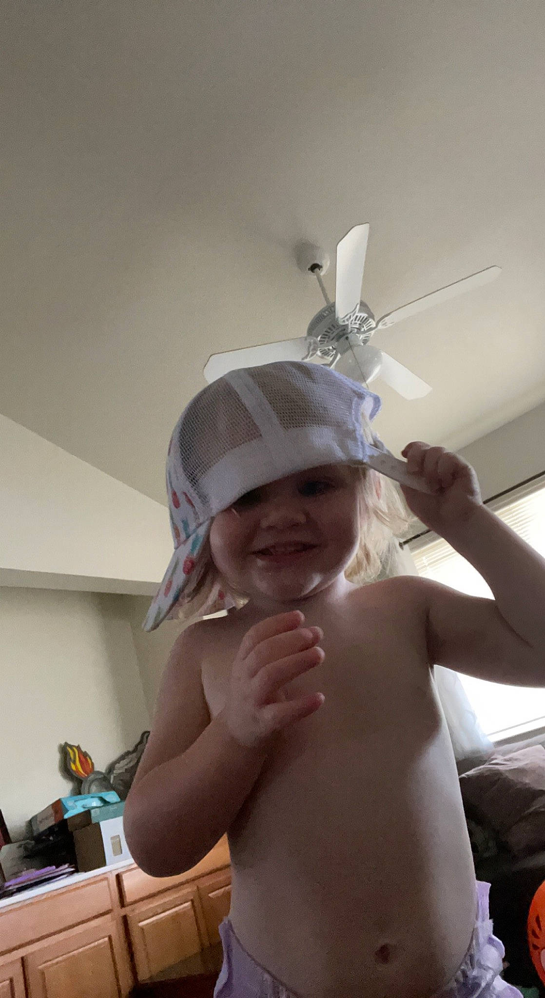 Serenity is registered to the contest to win money with this photo: baby, cap, elbow, event, finger, fun, gesture, happy, hat, headgear, headpiece, headwear, jewellery, joy, muscle, party_supply, person, shoulder, smile, swimwear