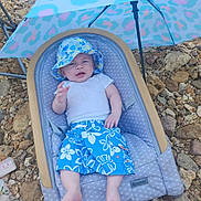 Olliemore is registered to the contest to win money with this photo: baby, bed, bonnet, cap, clothing, couch, crib, dress, face, furniture, gravel, hat, head, infantbed, person, road, shorts, slate, soil, sunhat
