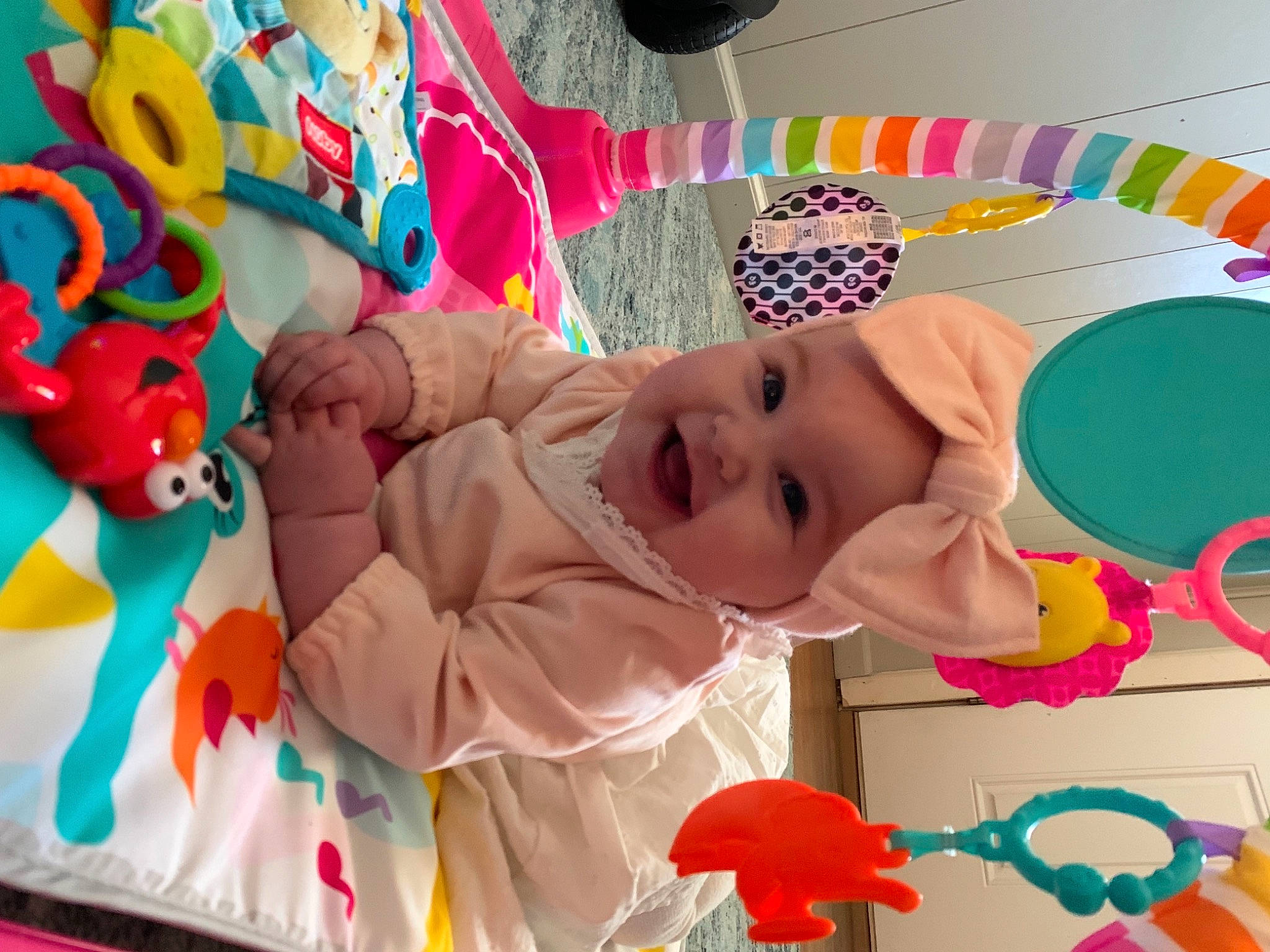 Milana is registered to the contest to win money with this photo: baby, baby_products, baby_toddler_clothing, baby_toys, cheek, child, event, facial_expression, fun, happy, headwear, linens, party, pattern, person, pink, play, product, smile, textile
