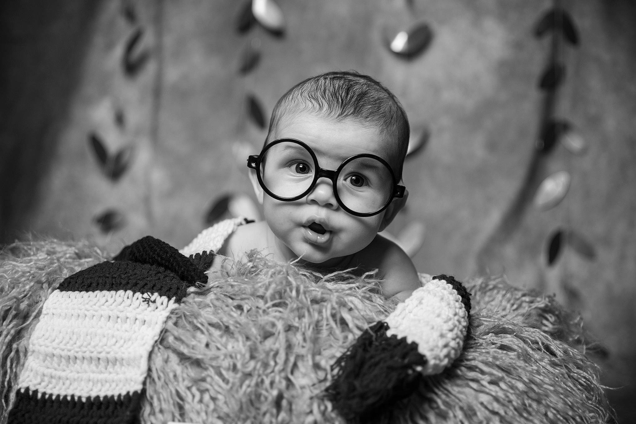 Luca joined the competition — help win amazing prizes! audio_equipment, baby, black_and_white, child, doll, eye, eyewear, flash_photography, fun, glasses, grass, happy, head, headgear, monochrome, monochrome_photography, person, style, toddler, toy