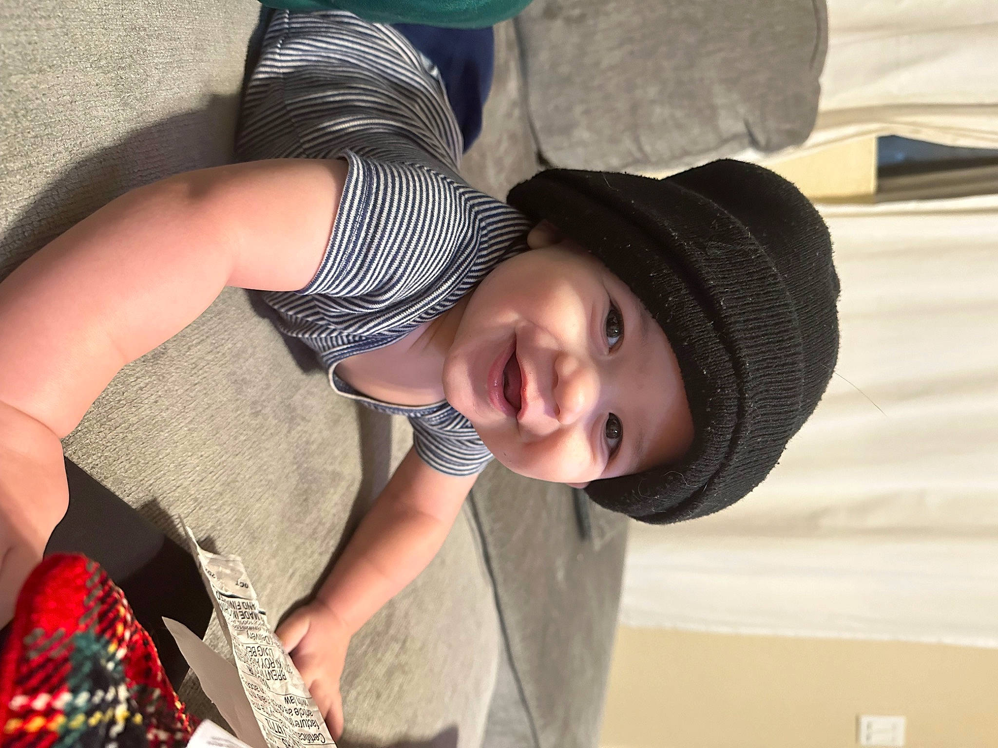 Luca is registered to the contest to win money with this photo: baby_toddler_clothing, beauty, cap, child, elbow, fashion_accessory, fun, hand, happy, hat, headwear, human_body, human_leg, joy, pattern, person, plaid, product, smile, sun_hat
