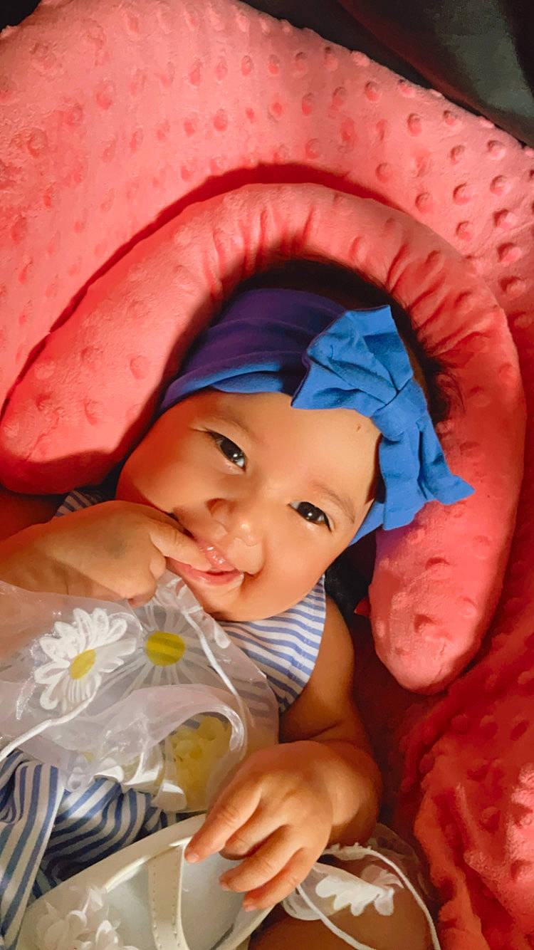 Aryah is registered to the contest to win money with this photo: baby, cap, cheek, chin, eye, facial_expression, finger, hand, happy, hat, headwear, human, mammal, mouth, muscle, organ, person, pink, product, skin