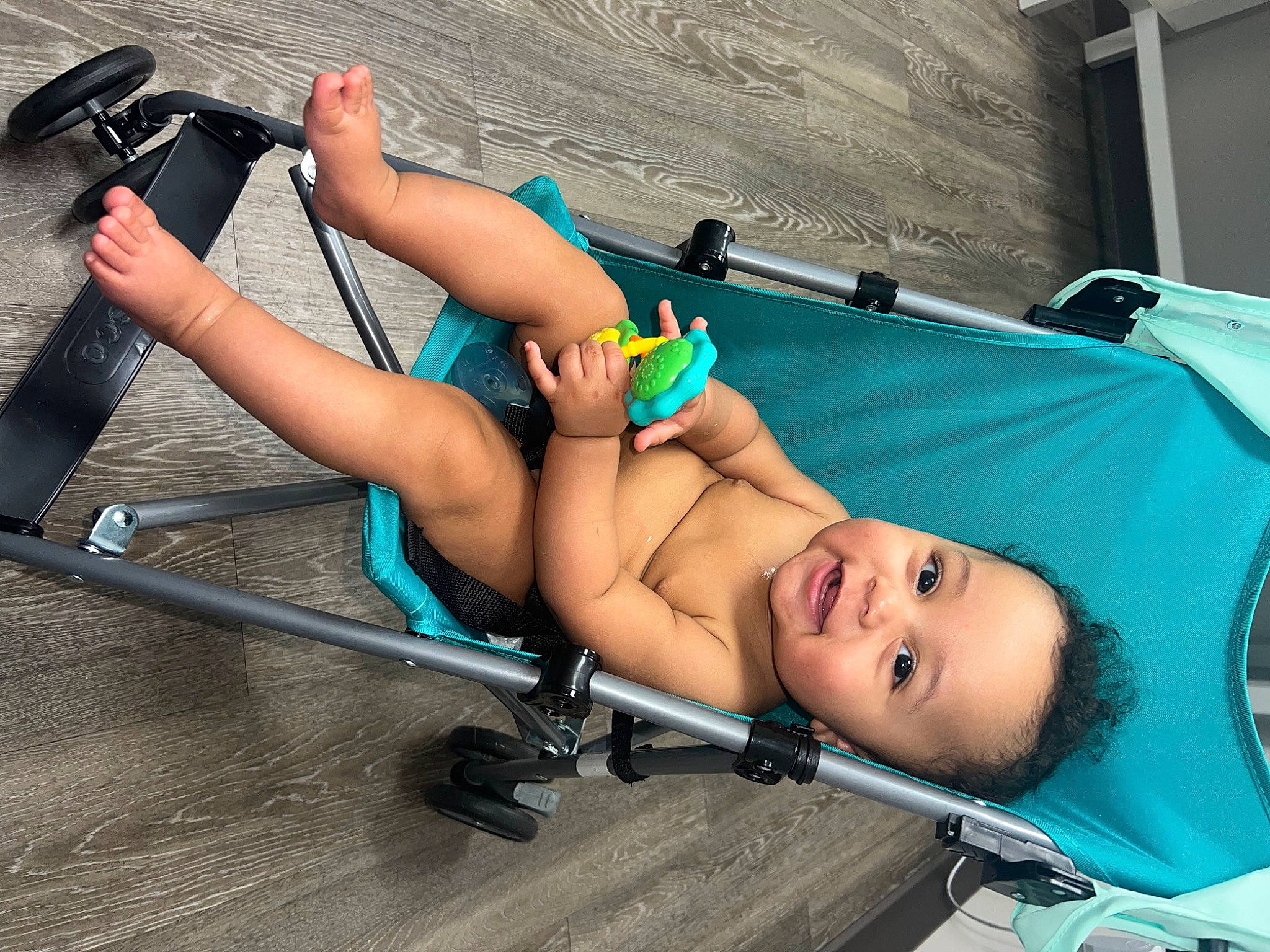 Archer is registered to the contest to win money with this photo: abdomen, chest, comfort, electric_blue, foot, fun, human_leg, joint, knee, leisure, lingerie, muscle, person, personal_protective_equipment, recreation, shorts, sitting, smile, sun_tanning, thigh