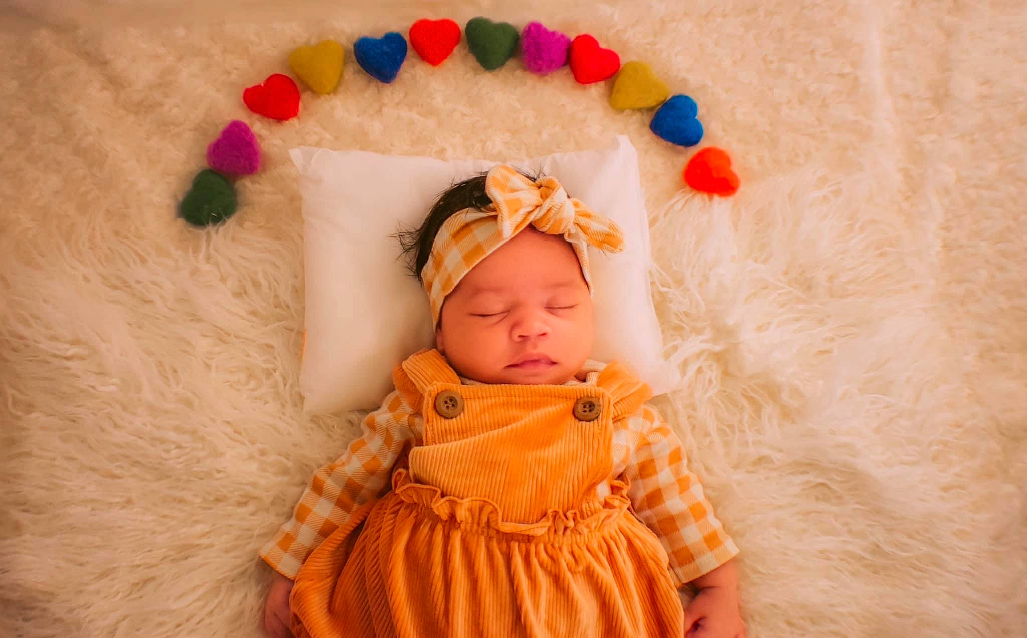 Emersyn is registered to the contest to win money with this photo: baby, baby_sleeping, baby_toddler_clothing, cheek, child, clothing, comfort, dress, fashion_accessory, happy, headgear, headwear, linens, orange, pattern, peach, person, pink, skin, sleeve