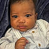 Bentley joined the competition — help win amazing prizes! baby, infant, child, face, eyes, hand, clothing, button, blanket, portrait, cute, closeup, fist, skin, person, expression, indoors, newborn, soft_texture, cozy