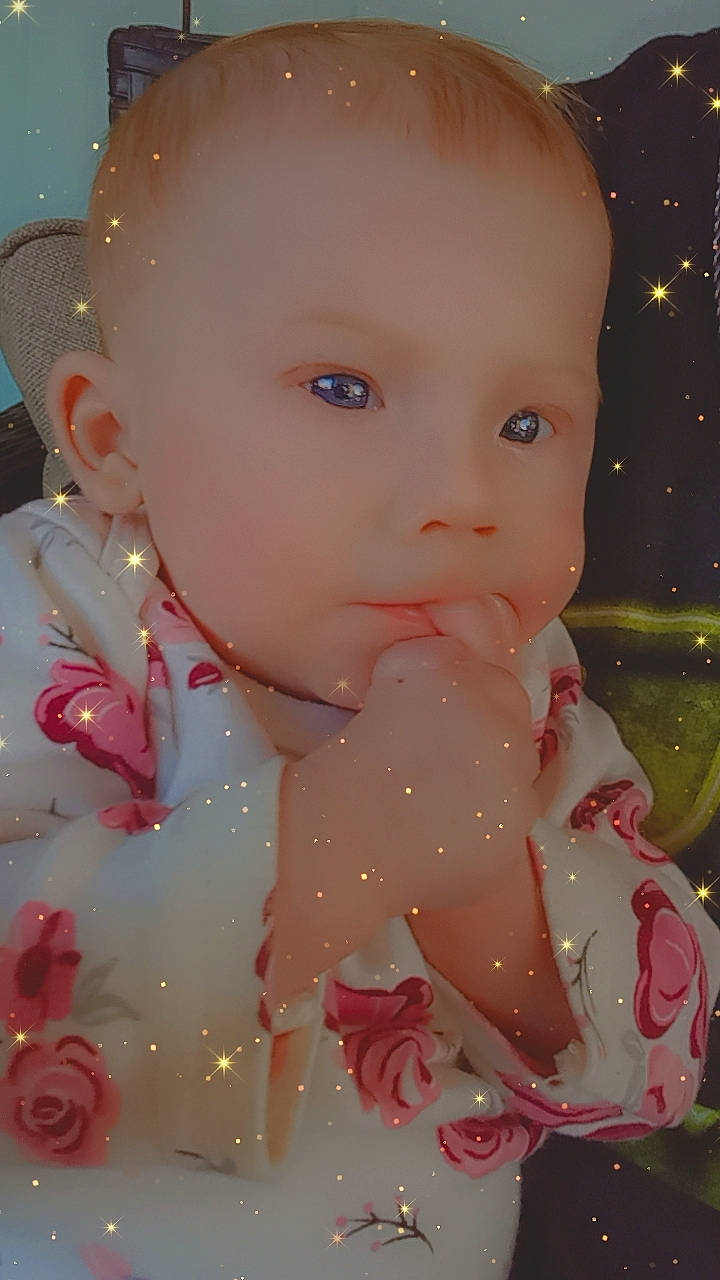 Alora joined the competition — help win amazing prizes! baby, baby_toddler_clothing, cheek, child, close_up, dress, embellishment, eyelash, fashion_accessory, fun, happy, lip, pattern, peach, person, petal, pink, portrait_photography, skin, sweetness