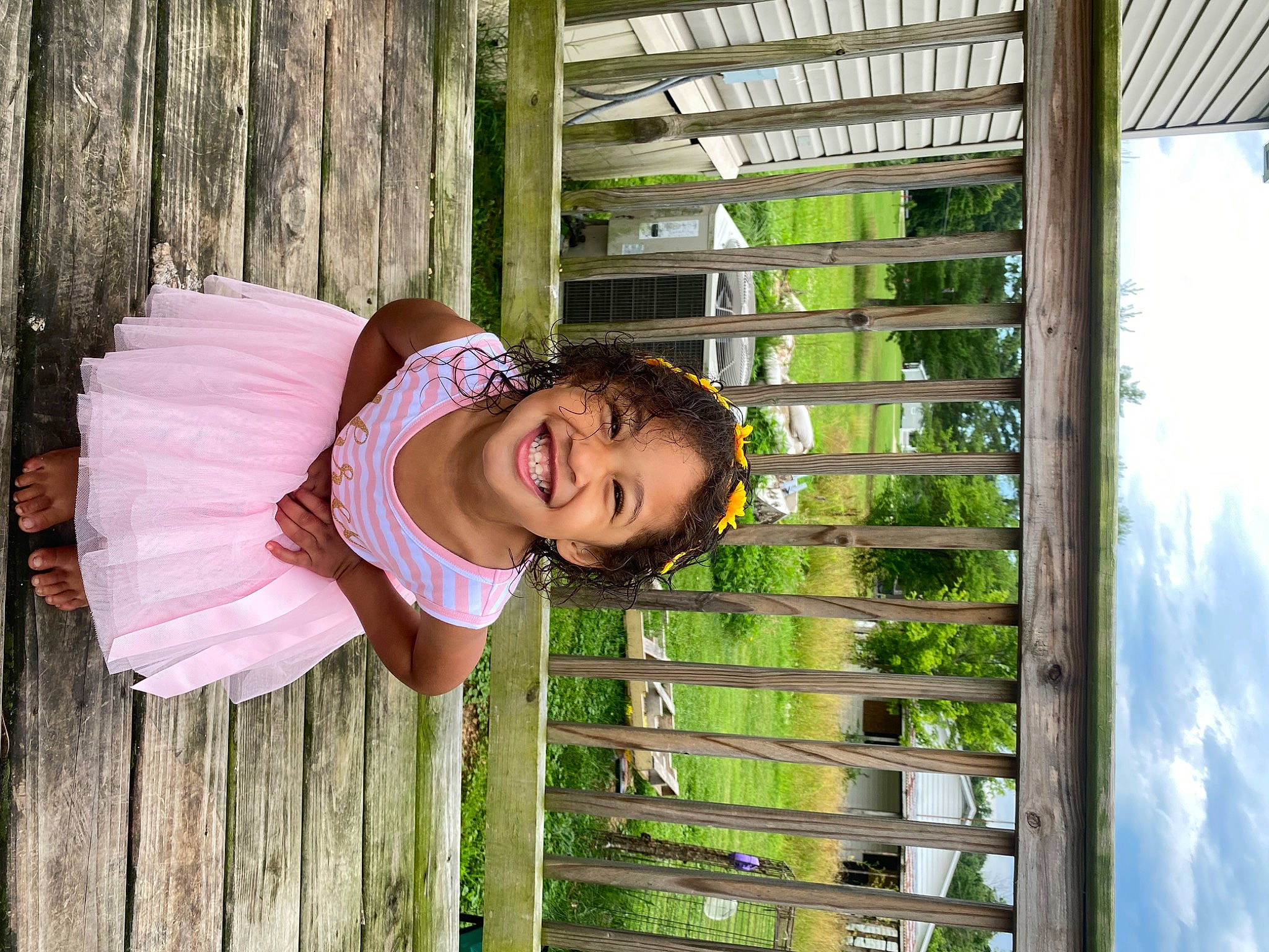 Sawyer is registered to the contest to win money with this photo: baby_toddler_clothing, cloud, fence, fun, grass, happy, hat, joy, laugh, leisure, magenta, mammal, people_in_nature, person, plant, sky, smile, toddler, tree, vacation