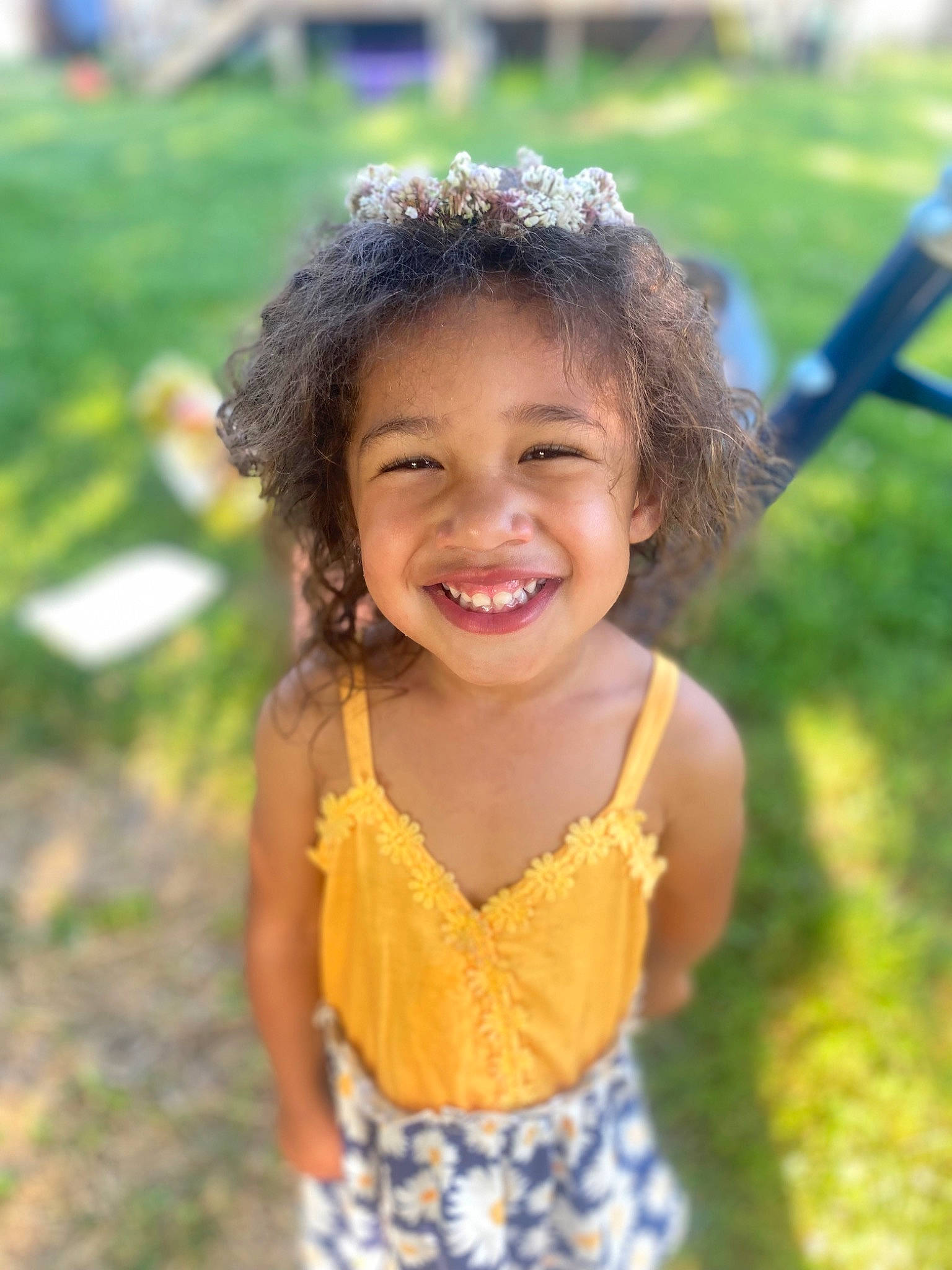 Sawyer is registered to the contest to win money with this photo: child, dress, facial_expression, fun, grass, grass_family, happy, joy, leaf, leisure, natural_environment, nature, people, people_in_nature, person, plant, rural_area, skin, smile, toddler