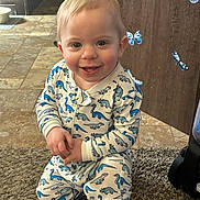 Jayce joined the competition — help win amazing prizes! toddler, child, smiling, dinosaur_pajamas, indoor, carpet, kneeling, blue_butterflies, wooden_background, happy, cute, young_child, floor_tiles, baby, face, person, playful, home, pajamas, decorations
