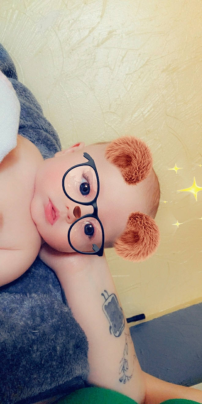 Kendal is registered to the contest to win money with this photo: arm, cheek, child, ear, joint, leg, nose, person, skin, tattoo, teddy_bear, toy, trunk, wrist