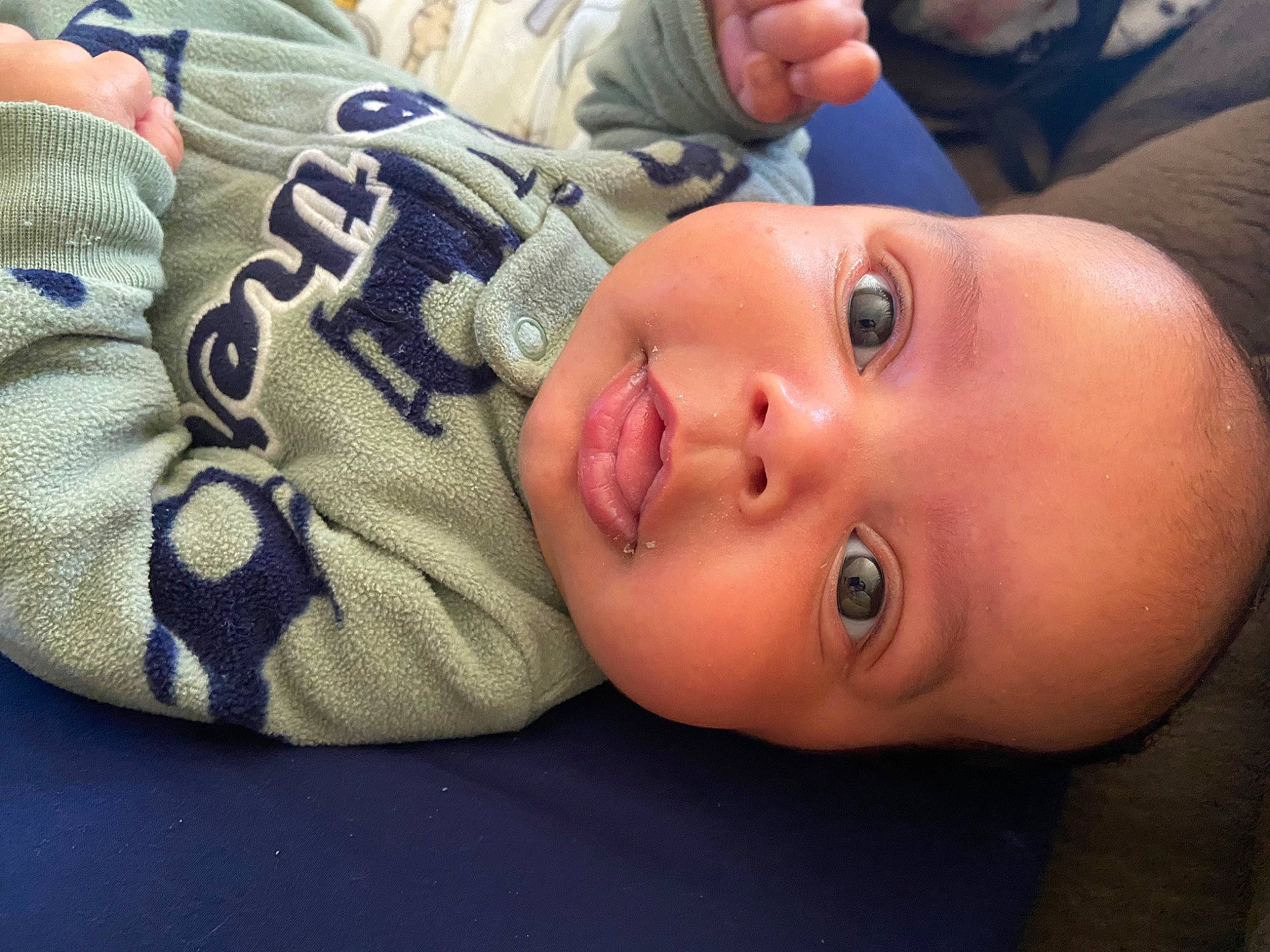 Kamari is registered to the contest to win money with this photo: baby, baby_products, baby_toddler_clothing, cap, cheek, child, comfort, eyelash, grass, happy, headgear, lip, nose, pattern, person, plant, sitting, skin, smile, toddler