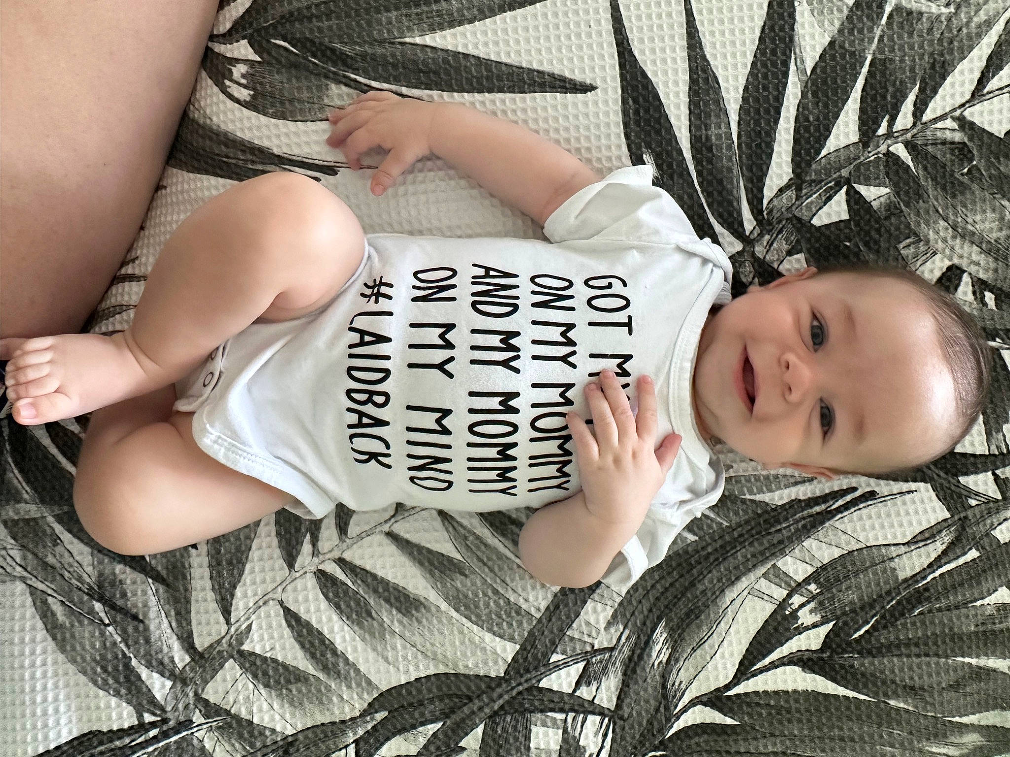 Amari joined the competition — help win amazing prizes! black_hair, comfort, elbow, eyelash, eyewear, flash_photography, foot, grass, happy, human_leg, knee, leg, pattern, person, plant, sitting, thigh, toddler, trunk, waist