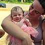Dafne is registered to the contest to win money with this photo: baby, child, woman, smile, hug, pink_dress, outdoor, nature, freckled_skin, sunglasses, affection, portrait, happy, holding, person, summer, casual_clothing, closeup, family, love