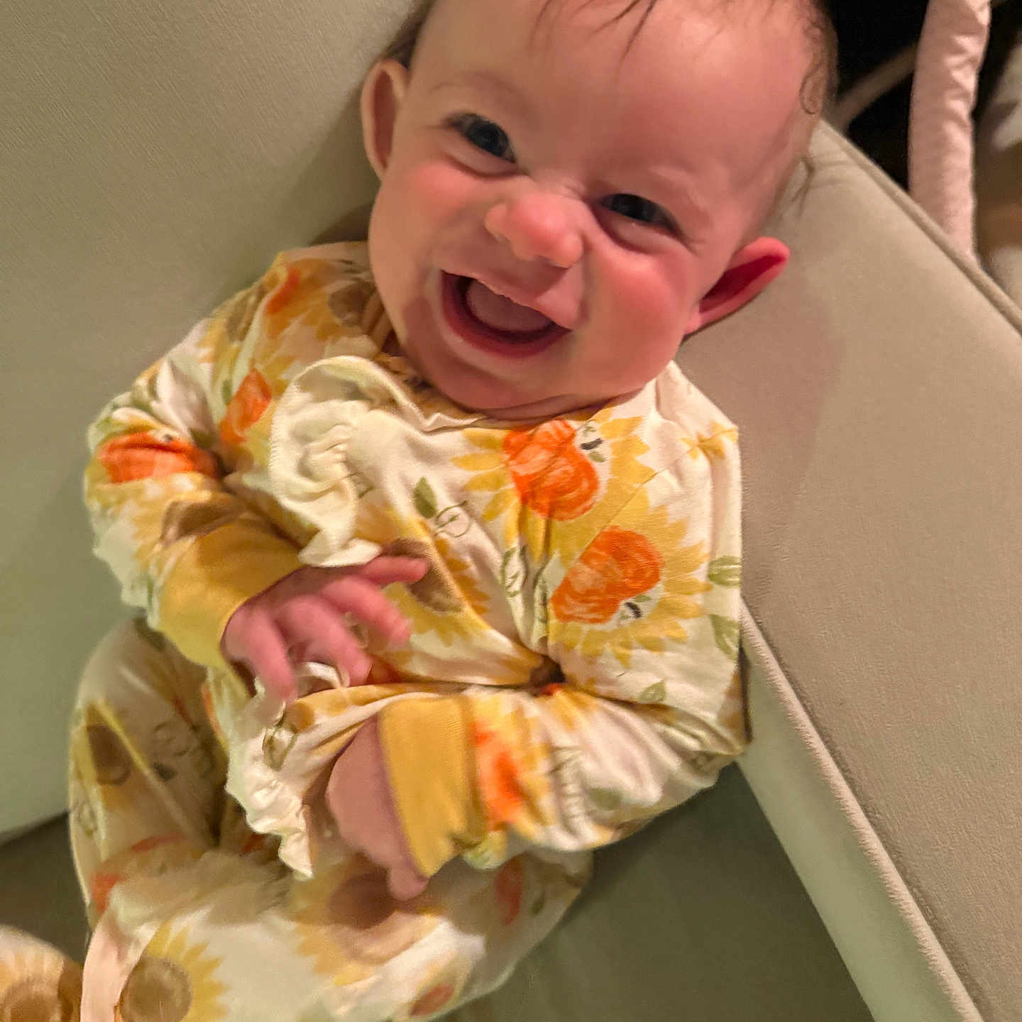 Dafne joined the competition — help win amazing prizes! baby, child, comfort, couch, cozy, cute, expression, face, furniture, hand, happy, head, indoor, infant, pajamas, person, sitting, skin, smiling, sunflower_pattern