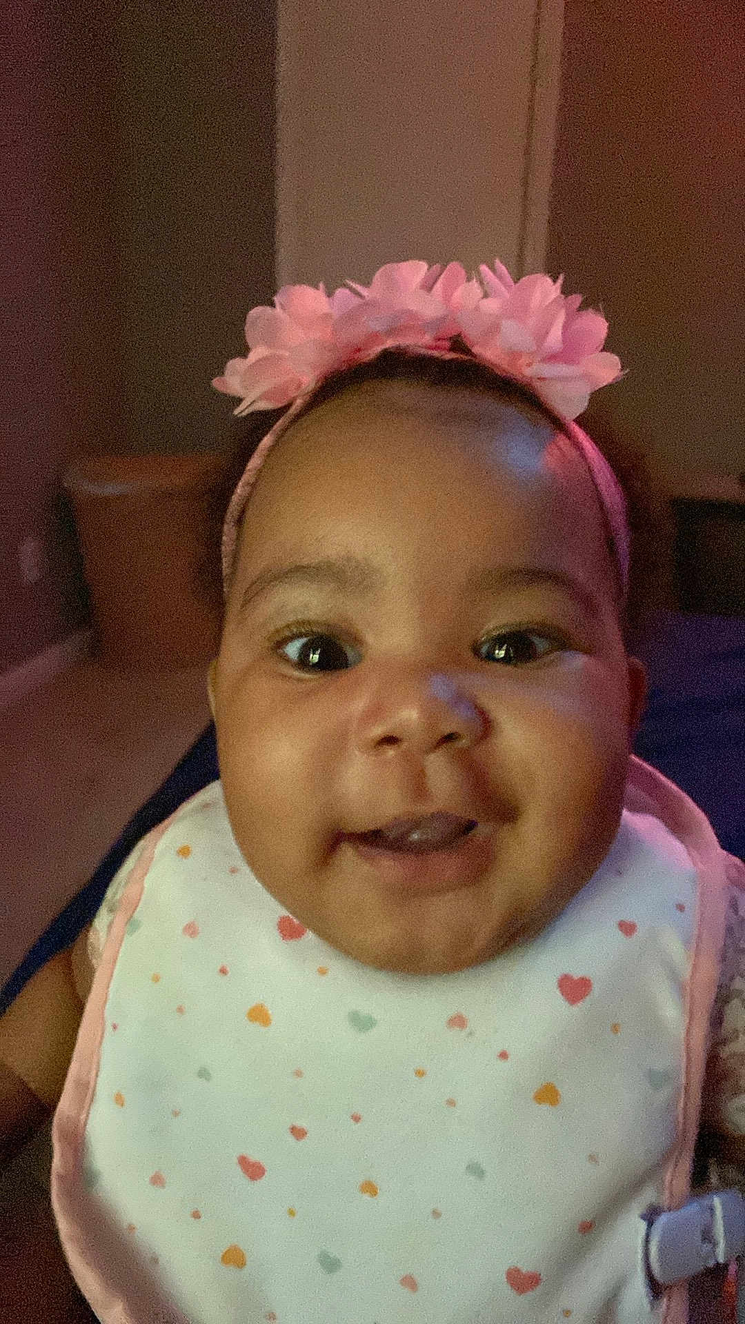 Amariaya joined the competition — help win amazing prizes! baby, child, smiling, headband, flower, bib, heart_pattern, face, indoor, portrait, cute, infant, happy, clothing, closeup, person, young_child, expression, headwear, human