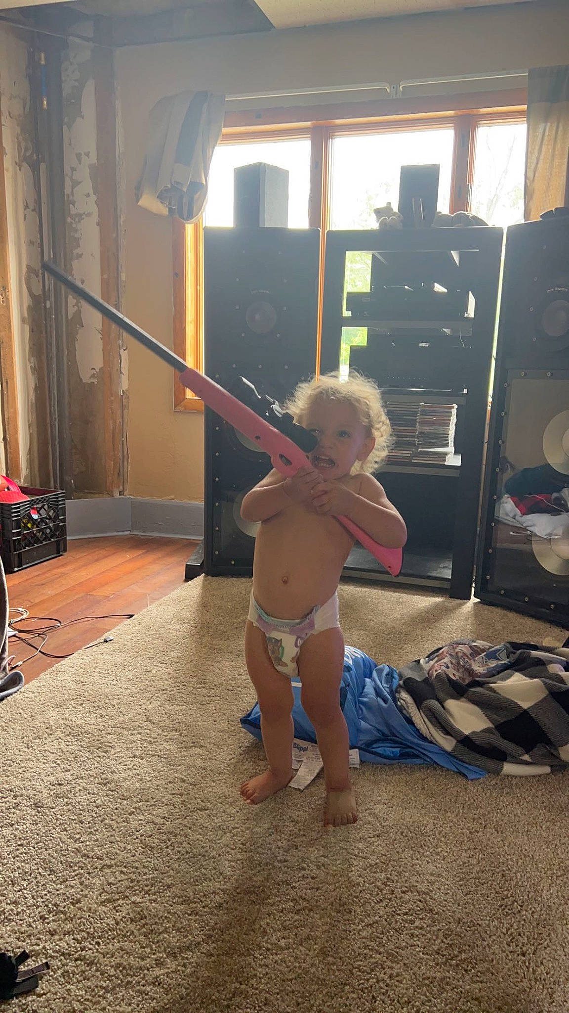 Waylon is registered to the contest to win money with this photo: baby, barechested, barefoot, cabinetry, chest, child, drawer, floor, flooring, fun, hardwood, human_leg, knee, person, swimwear, thigh, toddler, trunk, underpants, window