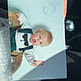 Octavius is registered to the contest to win money with this photo: baby, blue_eyes, bow_tie, bubble_wrap, bubbles, car_interior, child, clothing, cute, fingers, hand, light, person, photo, portrait, shadow, sitting, skin, suspenders, wicker_chair