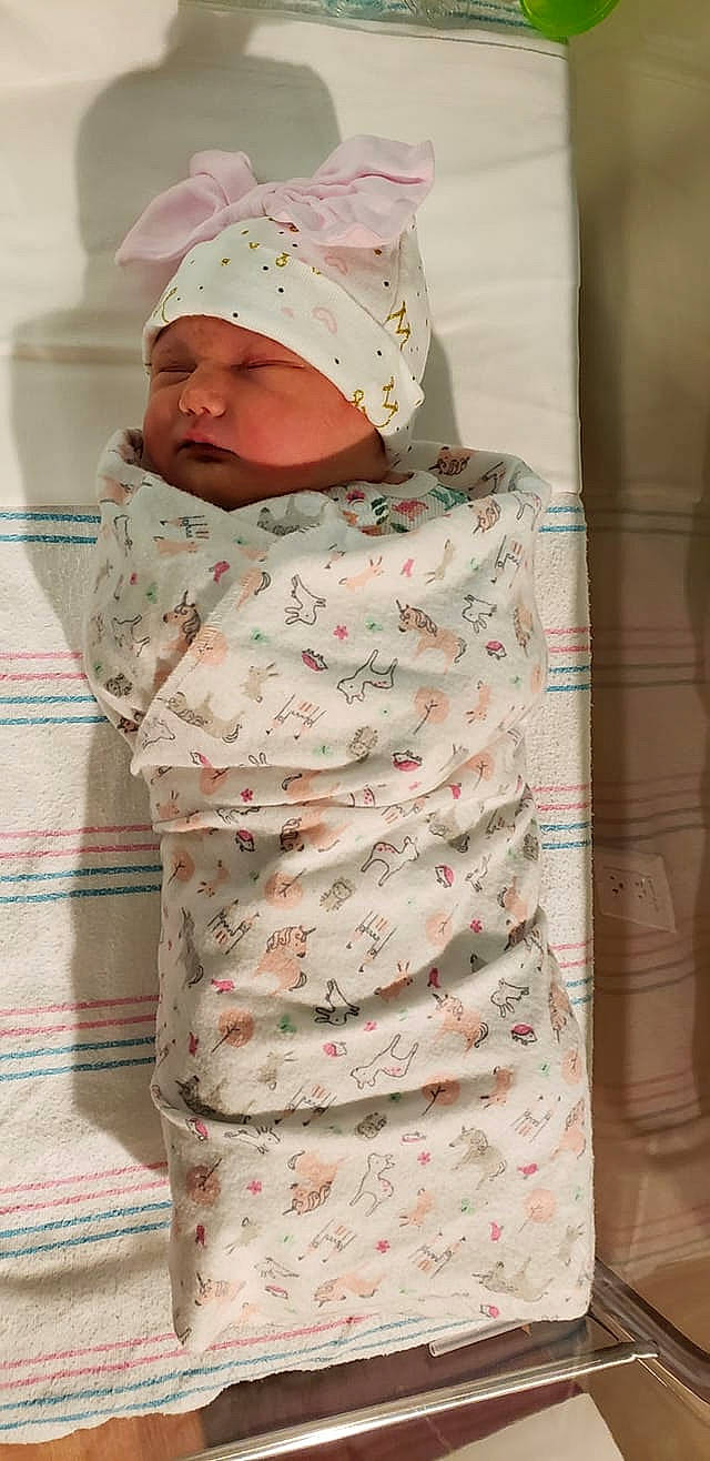 Bethany is registered to the contest to win money with this photo: child, headgear, headwear, infant, linens, material, person, pink, product, textile, toddler