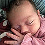 Ruby-Leigh is registered to the contest to win money with this photo: baby, sleeping, hand, face, pink_sweater, closeup, infant, skin, eyelashes, fingers, texture, cozy, rest, peaceful, child, portrait, soft_light, cute, newborn, warm
