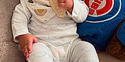 Eilena Lea joined the competition — help win amazing prizes! baby, child, infant, pajamas, bib, snack, waffle, cushion, plush_pillow, logo, indoor, sitting, hand, face, blue_eyes, clothing, bed, comfort, relaxed, cute
