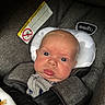 Stewart joined the competition — help win amazing prizes! baby, blanket, car_seat, caution_label, child, closeup, clothing, cute, expression, face, head, indoor, infant, person, portrait, safety, seatbelt, skin, straps, young