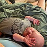 arm, baby, blanket, casual, clothing, footwear, hand, head, indoor, infant, lap, peaceful, person, relaxation, rest, skin, sleeping, stroller, toddler, water_bottle