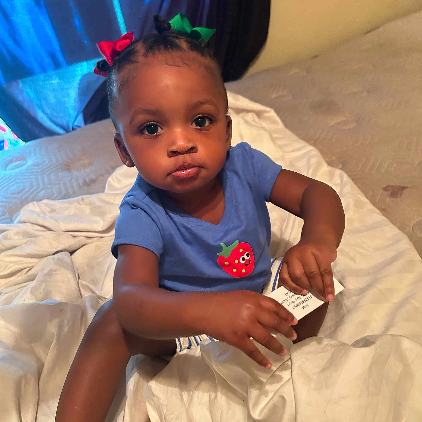 Kamiya joined the competition — help win amazing prizes! toddler, child, baby, blue_shirt, bows, hair, bed, blanket, indoors, curious, skin, person, sitting, small_object, white_shoes, fabric, light, expression, cute, room