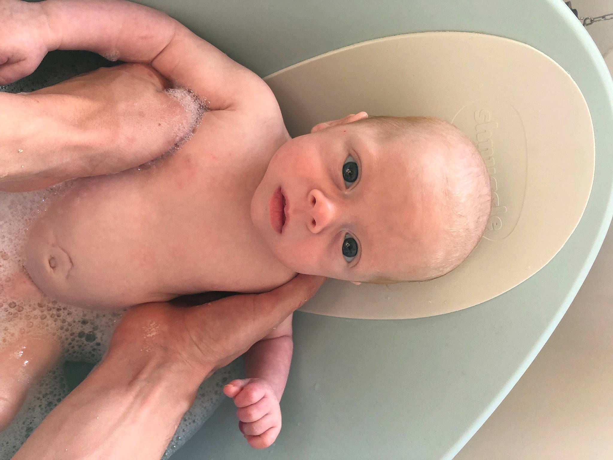 Seth is registered to the contest to win money with this photo: baby, baby_products, bathing, cheek, chest, child, eye, eyelash, finger, gesture, head, human_body, iris, lip, mouth, nose, person, skin, stomach, thumb