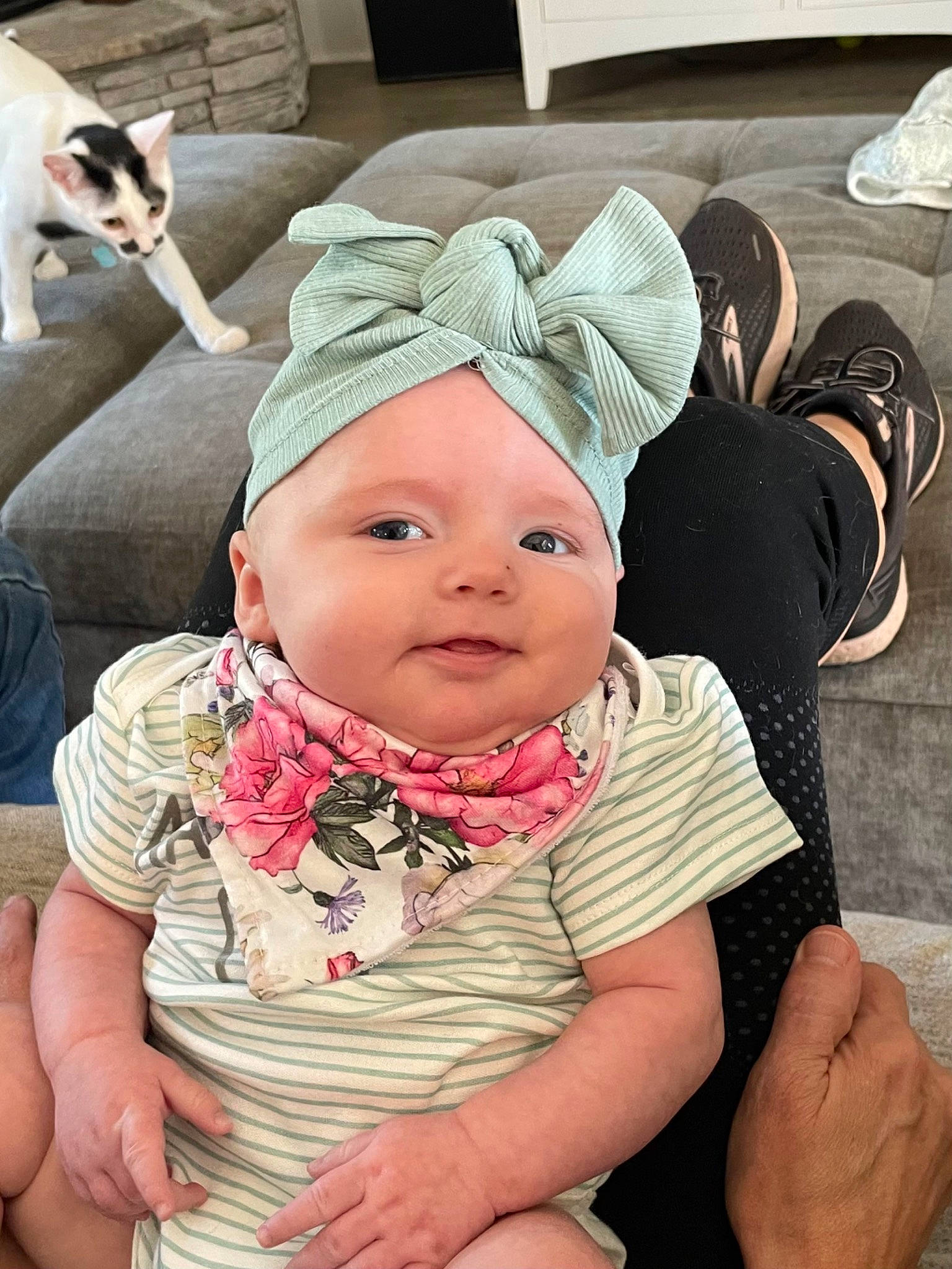 Kaycee joined the competition — help win amazing prizes! baby, baby_toddler_clothing, beanie, cap, child, comfort, couch, fashion_accessory, finger, flooring, fun, gesture, happy, headwear, linens, pattern, person, room, sitting, thumb