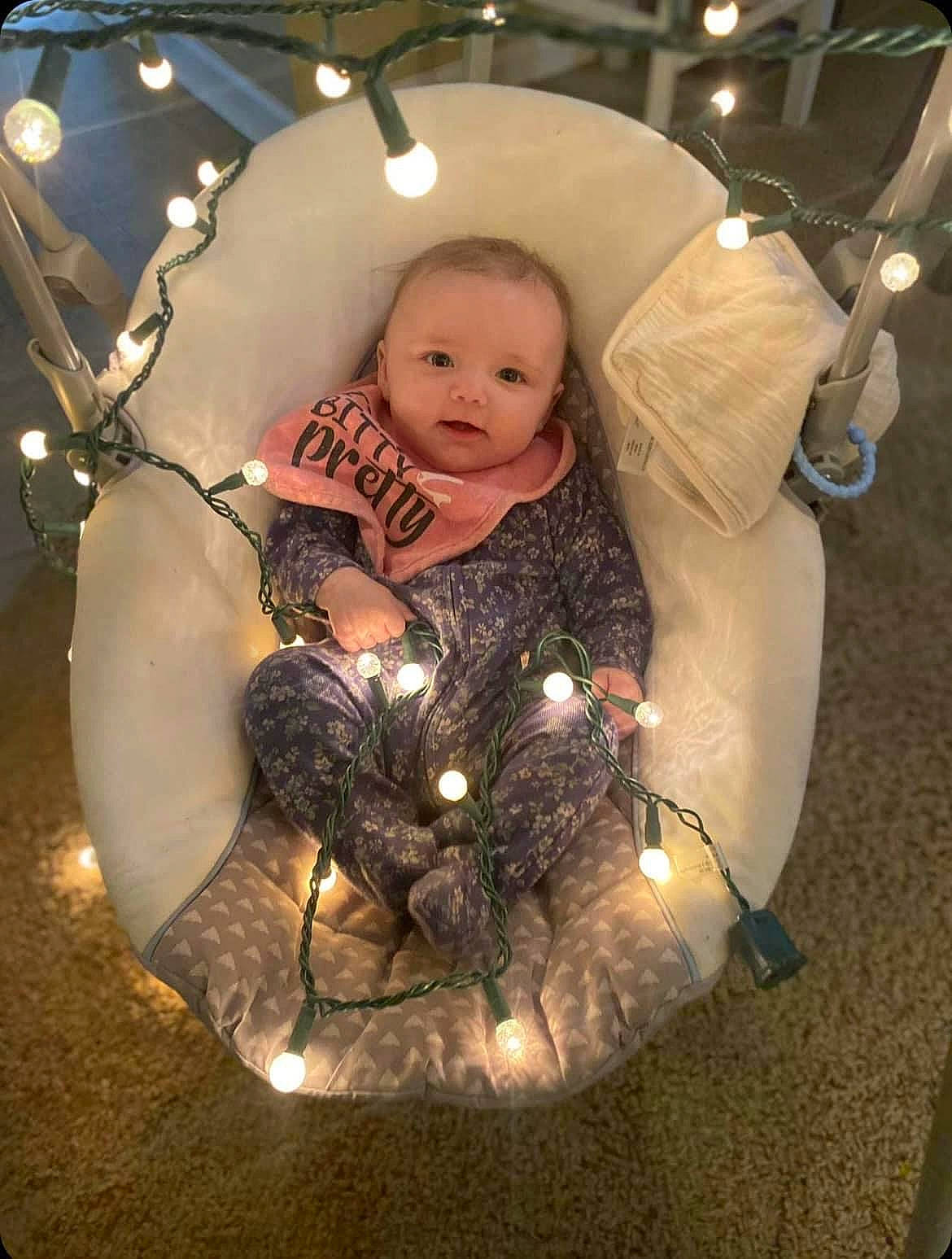 Kaycee joined the competition — help win amazing prizes! baby, child, christmas, christmas_decoration, christmas_eve, christmas_lights, darkness, event, flash_photography, fun, happy, holiday, interior_design, ornament, person, portrait_photography, sitting, space, toddler, winter