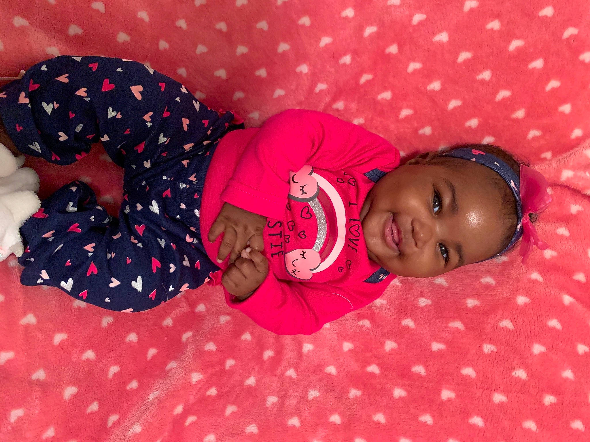 Khalani joined the competition — help win amazing prizes! baby, baby_toddler_clothing, cheek, child, comfort, facial_expression, joy, nightwear, nose, pattern, person, pink, polka_dot, skin, textile, toddler
