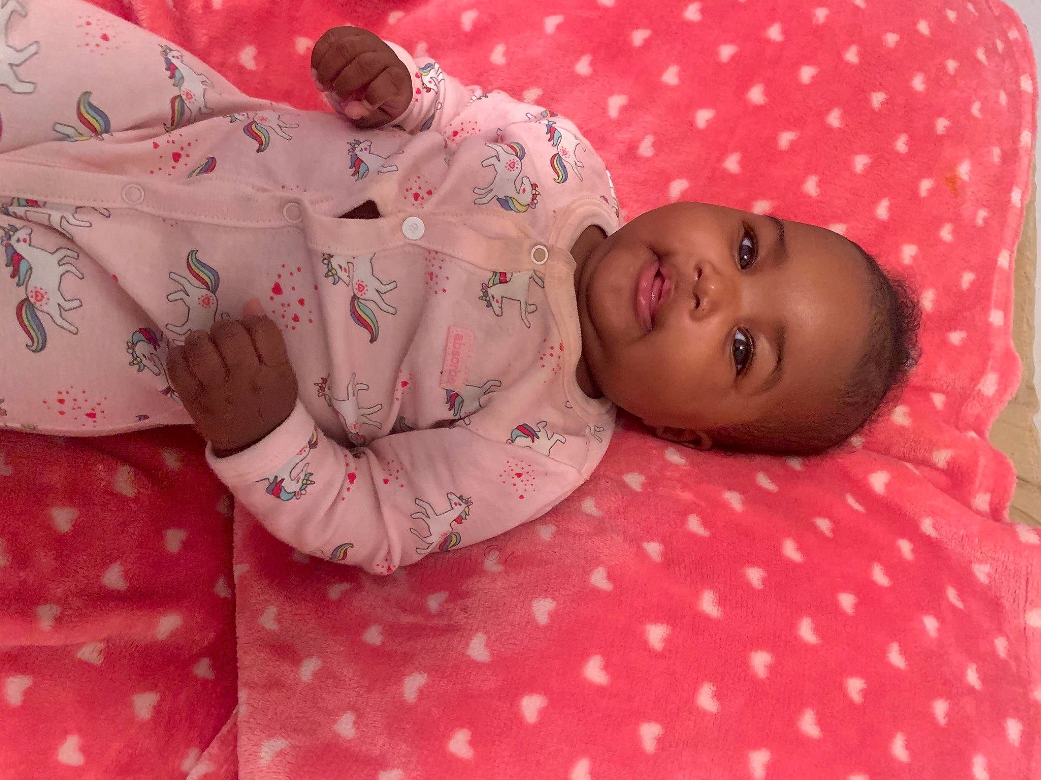 Khalani is registered to the contest to win money with this photo: baby, baby_toddler_clothing, cheek, child, comfort, linens, lip, nightwear, pajamas, pattern, peach, person, pink, plaid, polka_dot, skin, textile, toddler