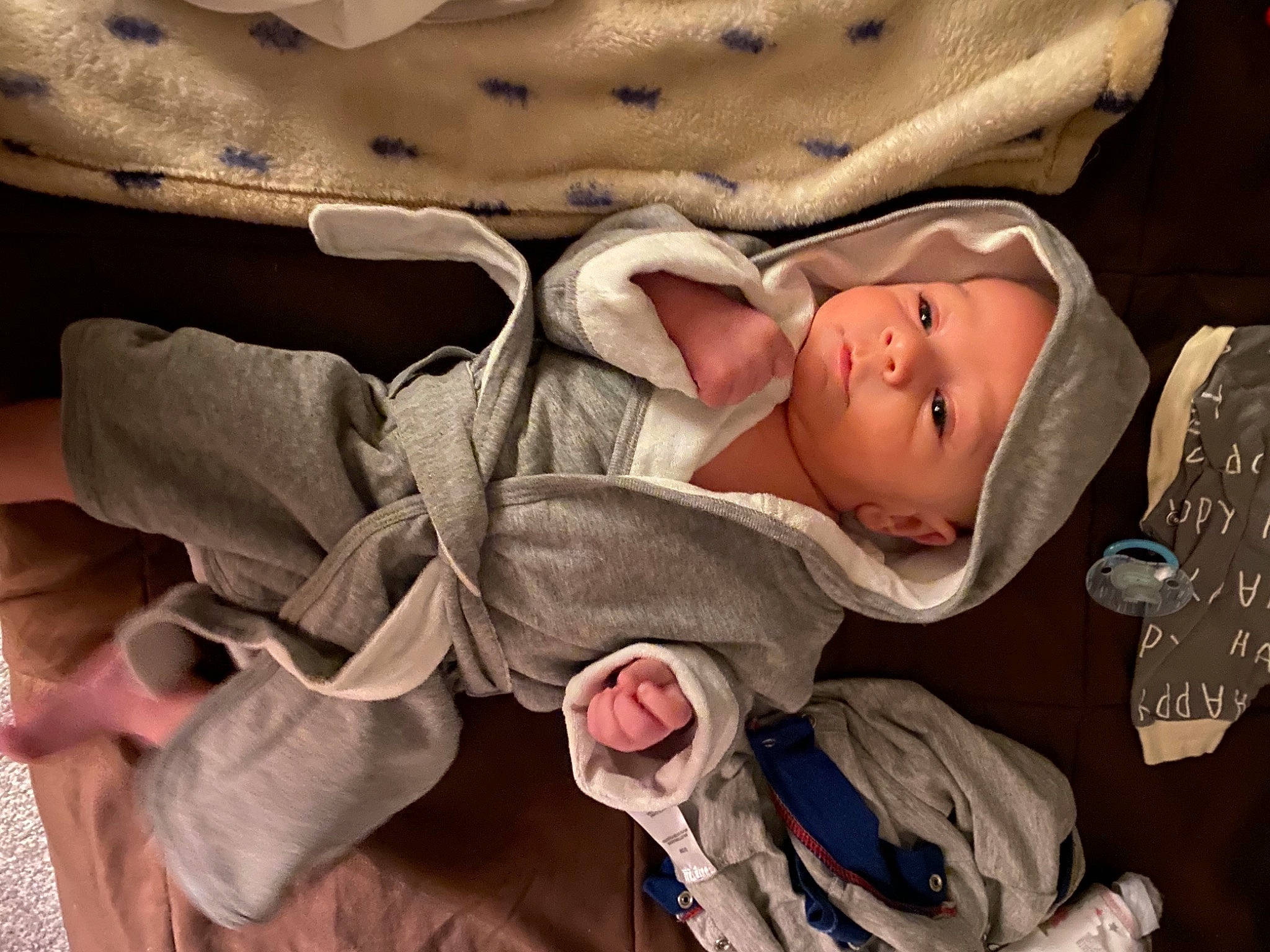 Deegan is registered to the contest to win money with this photo: baby, baby_products, baby_toddler_clothing, beige, cheek, child, comfort, headwear, hood, khaki, person, skin, toddler