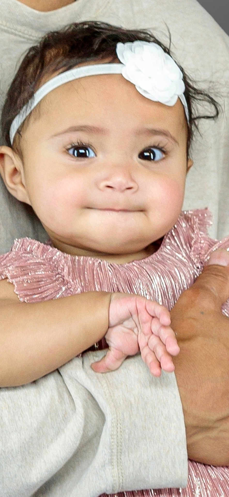 Marissa joined the competition — help win amazing prizes! baby, child, face, headband, flower, dress, pink, hand, skin, person, portrait, cute, infant, young, holding, clothing, closeup, expression, eyes, female