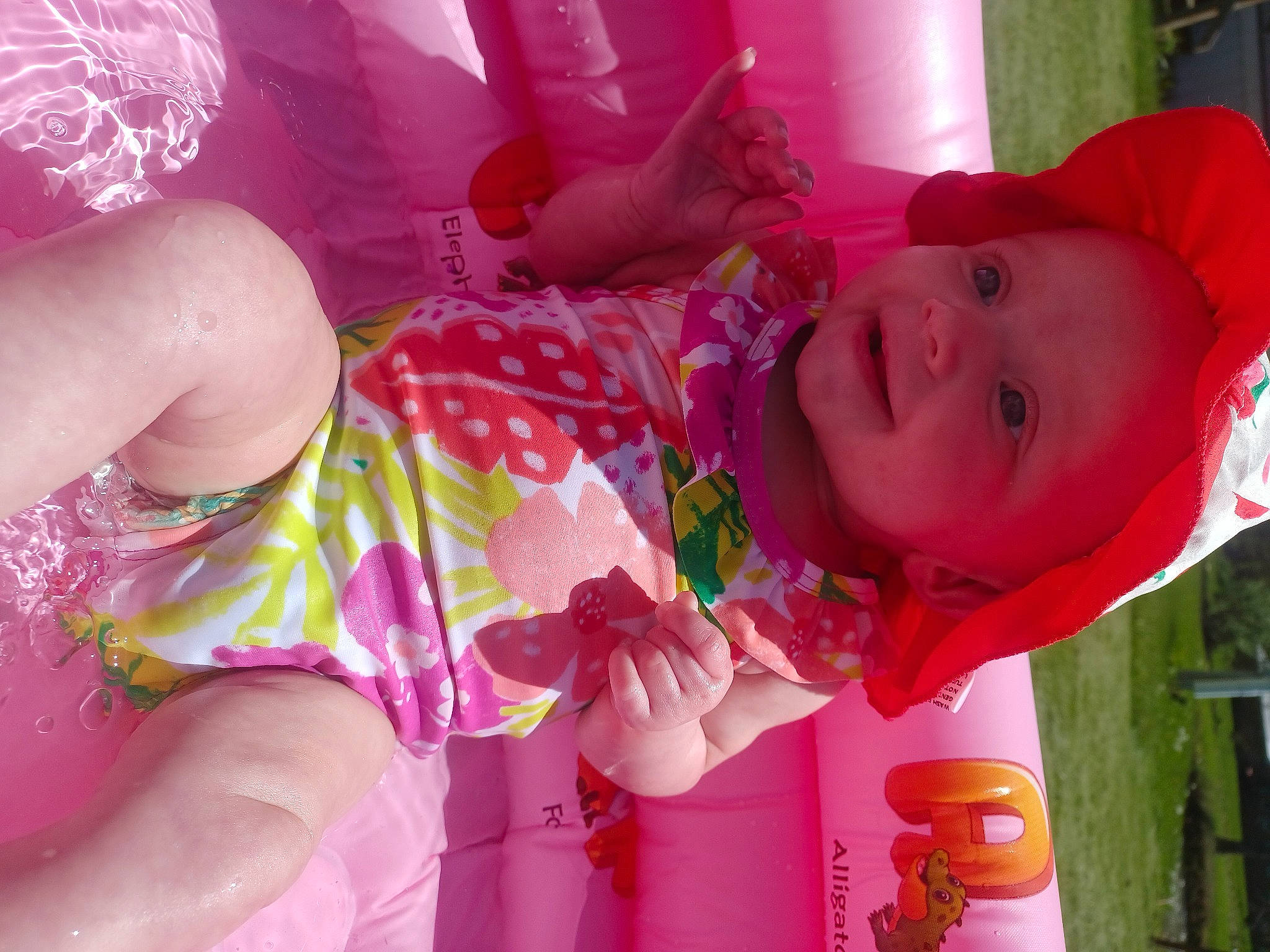 Savannah is registered to the contest to win money with this photo: baby, baby_toddler_clothing, cheek, dress, eye, face, facial_expression, fun, happy, headwear, human_body, magenta, mouth, orange, person, pink, product, red, skin, smile
