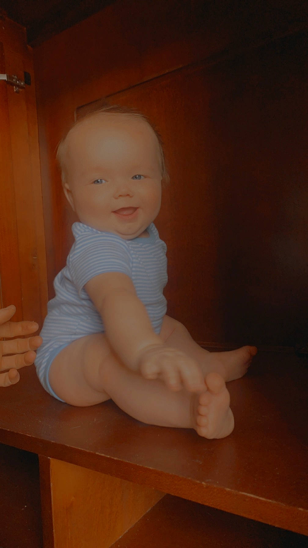 Houston is registered to the contest to win money with this photo: baby, baby_toddler_clothing, barefoot, cheek, chin, elbow, eye, floor, flooring, foot, human_leg, knee, leg, person, skin, smile, thigh, thumb, toddler, trunk