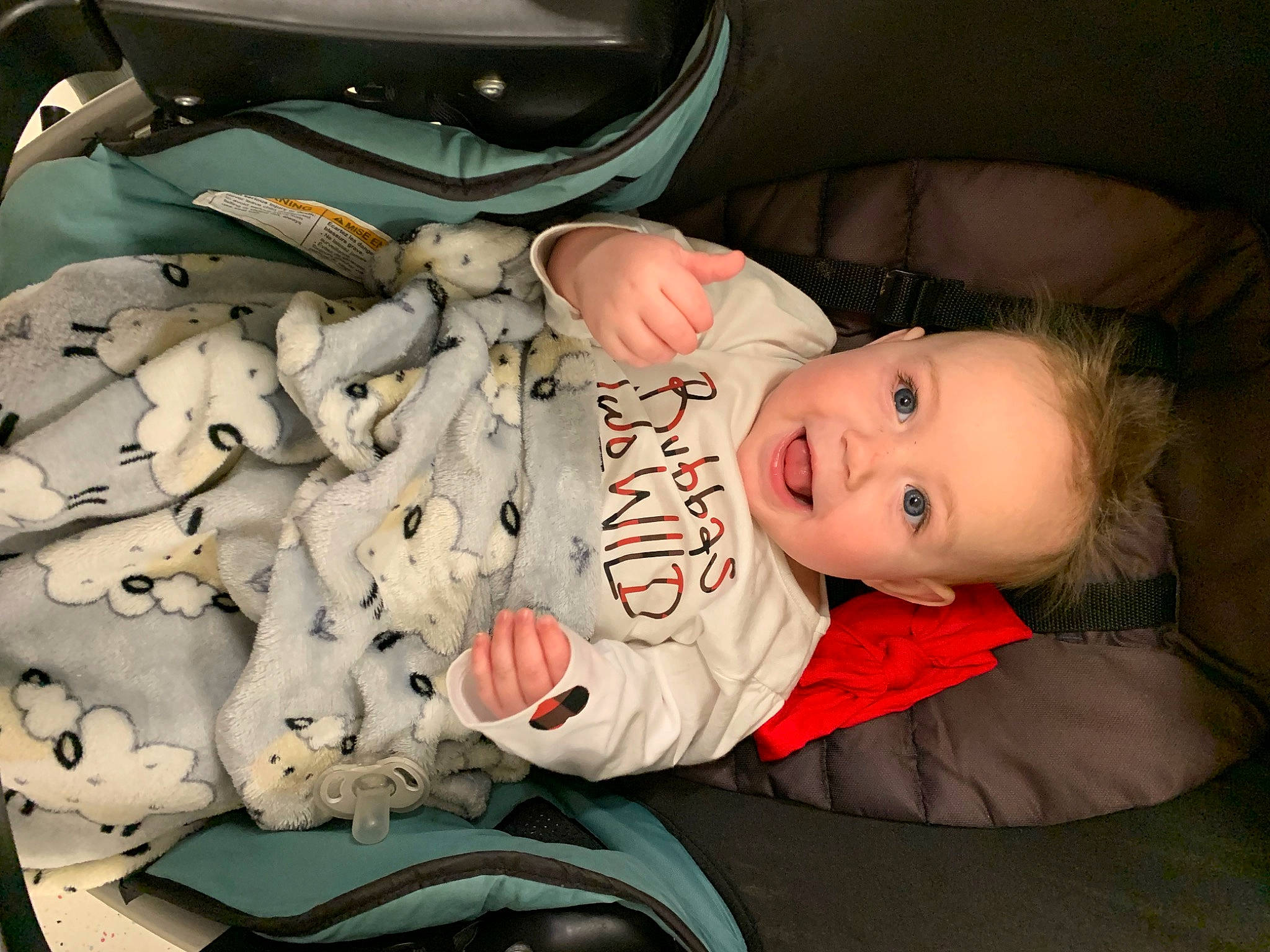 Ryleigh is registered to the contest to win money with this photo: auto_part, baby, baby_carriage, baby_products, baby_toddler_clothing, car_seat, carmine, cheek, child, comfort, eye, family_car, fun, lap, person, room, sitting, smile, toddler, trunk
