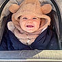 baby, child, smile, hoodie, teddy_bear_ears, jacket, stroller, outdoor, happy, face, infant, cute, warm_clothing, baby_clothes, portrait, person, baby_boy, cozy, daylight, closeup
