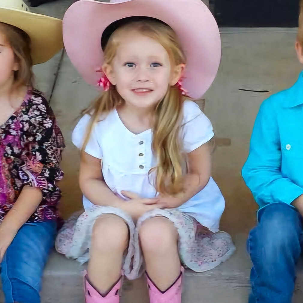 Taylor is registered to the contest to win money with this photo: boy, child, clothing, cowboyhat, face, female, girl, happy, hat, head, laughing, male, person, sitting, sleeve, smile, sunhat