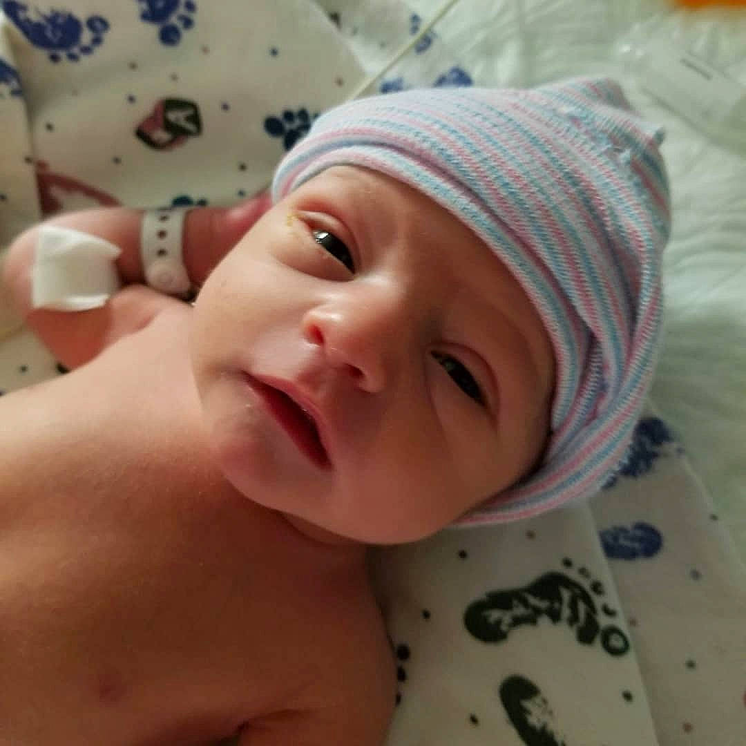 Sunny joined the competition — help win amazing prizes! baby, baby_products, baby_toddler_clothing, barechested, beanie, bonnet, cheek, child, eyebrow, eyelash, headwear, knit_cap, person, photography, skin, toddler, wool