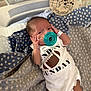 Psalms joined the competition — help win amazing prizes! baby, newborn, pacifier, onesie, football, blanket, stars, hospital, medical_tube, wooden_sign, mickey_mouse, infant, cute, lying_down, clothing, face, hand, nursery, soft_lighting, cozy