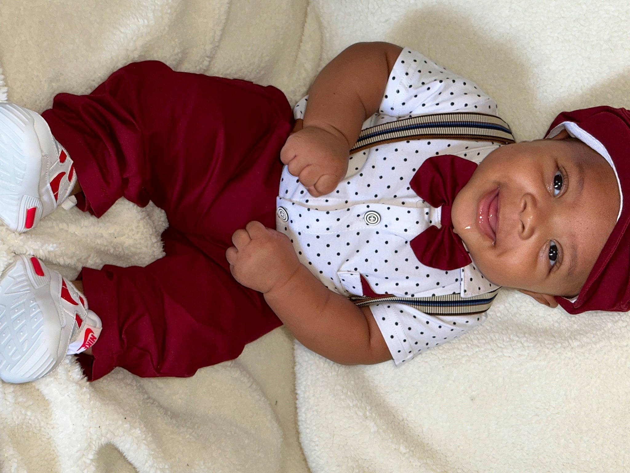 Jaylin is registered to the contest to win money with this photo: arm, baby_toddler_clothing, child, comfort, eye, finger, hand, headwear, human_body, human_leg, joy, lap, leg, linens, mammal, person, product, skin, sleeve, smile
