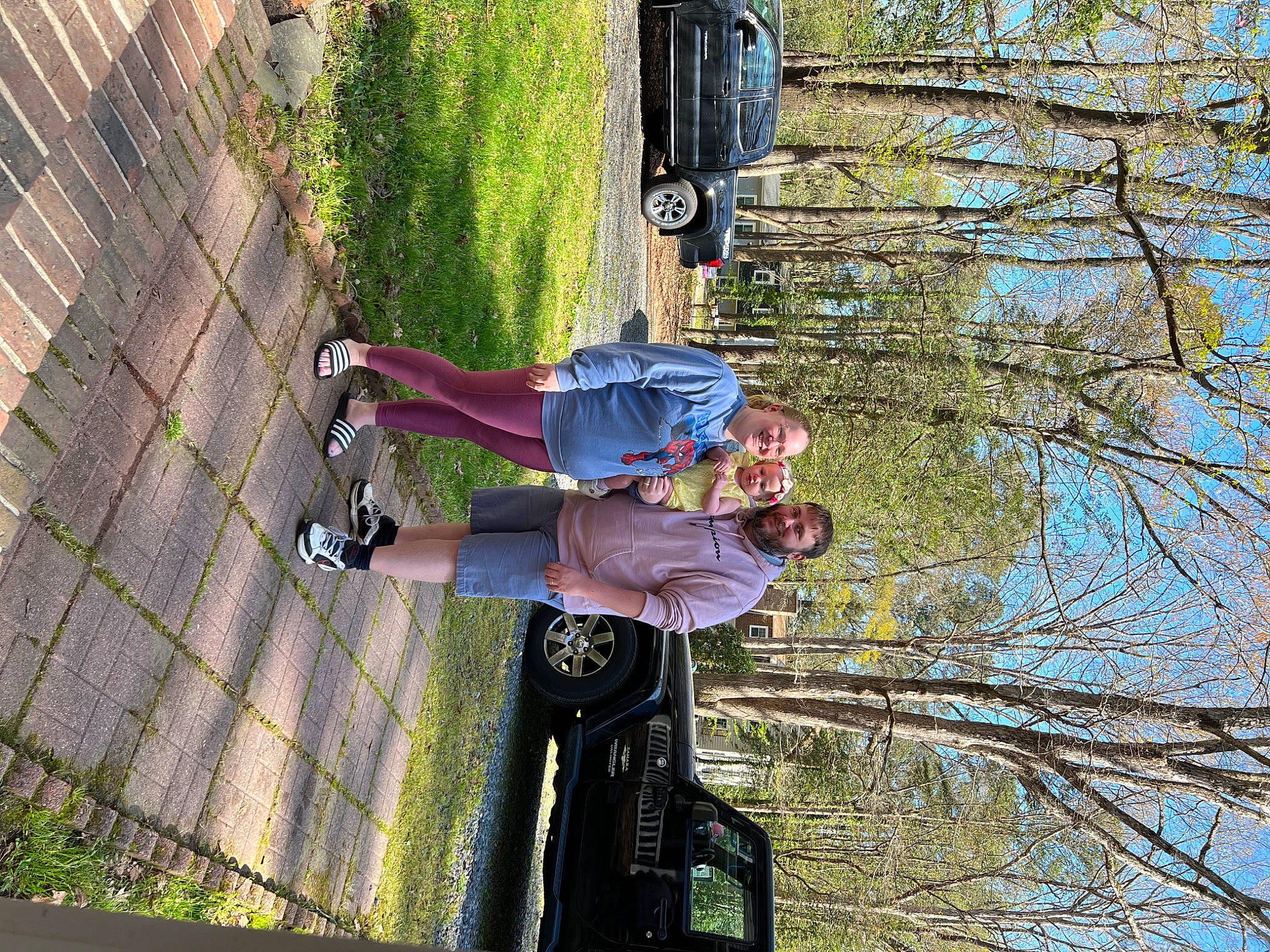 Alanah is registered to the contest to win money with this photo: adventure, car, clothing, fun, headwear, joy, leisure, person, plant, recreation, shadow, sky, smile, street_stunts, tire, tree, vehicle, walking_shoe, wheel, woody_plant