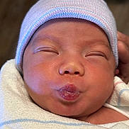 Nathaniel joined the competition — help win amazing prizes! baby, newborn, face, hat, blanket, wrapped, cute, infant, puckered_lips, sleeping, skin, closeup, adorable, child, soft, newborn_baby, headwear, person, peaceful, tiny